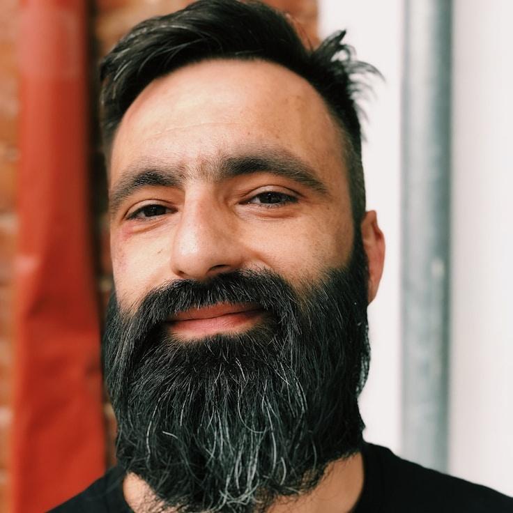 Ava Singh, Lead Design Curator at Star Light Garden Community, reviewing corporate floral arrangements